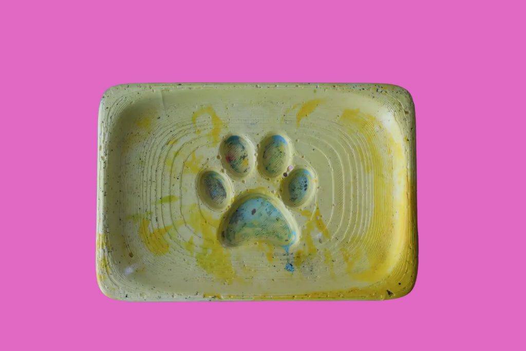 Yellow rectangular soap holder with a paw print design 